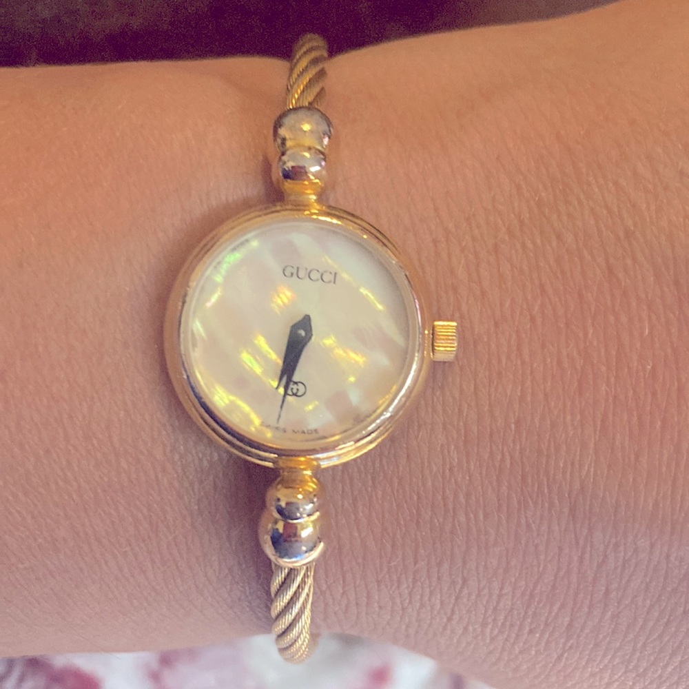 Gucci authentic ladies gold - mother of pearl bangle watch 100% authentic, used.